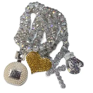 Iced. Pendant Bracelet with Cross, Glove, and Pearl Charm, Includes Clear Beads with AB Crystal Spacer beads.