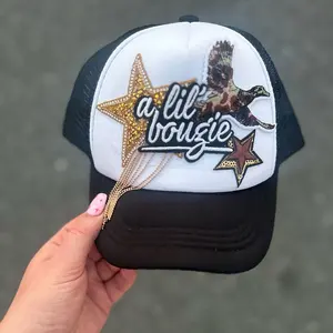 A Lil Boujee and A Lil Hunter collides! One of a kind trucker hats!
