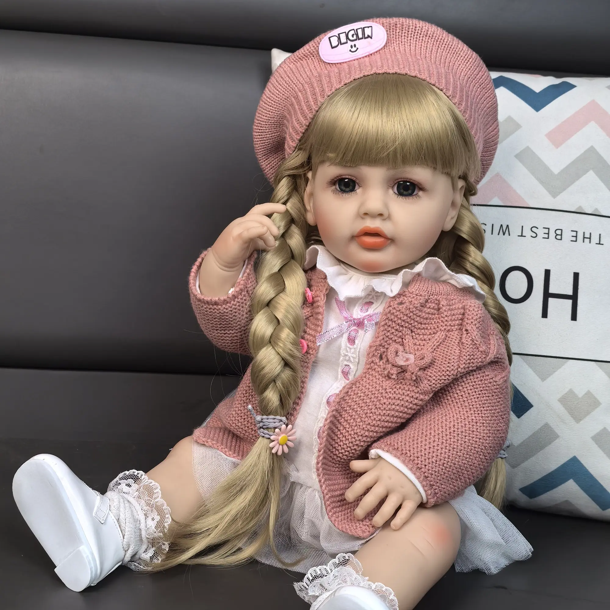 KEIUMI 22in Vinyl Newborn Girl Baby Doll Betty - Gorgeous Full Body Soft Doll, 2 Golden Braids, Blue Eyes, White Peter Pan Collar Dress, Dusty Pink Cardigan, Beret, Lace Socks, Leather Shoes, 2 Pink Daisy Hair Ties, Kids 3+ Birthday Christmas Gift, Girl T
