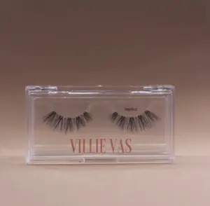 Angelicat Lashes by Villie Vas  A delicate yet alluring lash that serves sophisticated beauty. A 3/4 invisi-band displays an array of delicate faux mink fibers that gradually lengthen and curl making your eyes look sweetly sinful.