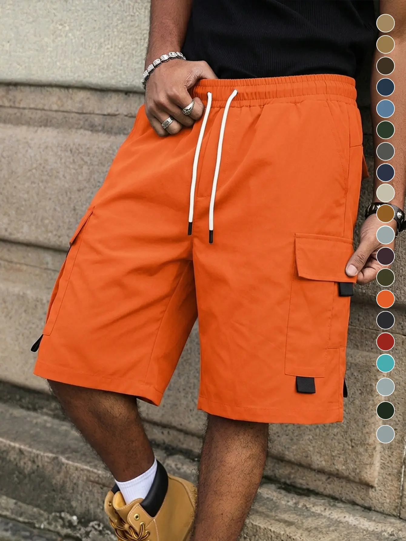 Men’s orange cargo shorts made from quick-drying, breathable fabric; available in multiple colors; elastic drawstring waist; functional cargo pockets with tabs and details; suitable for summer streetwear, everyday errands, outdoor walks, and daily wear.