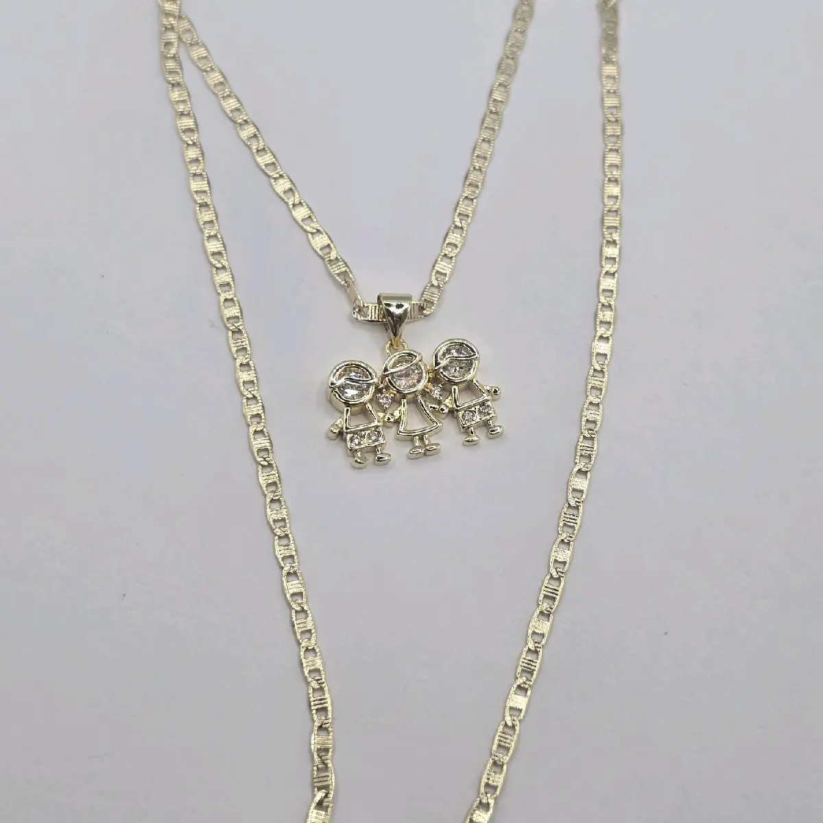 Beautiful necklace with two boys and girl pendant  clear stone's small size chain 18"inches