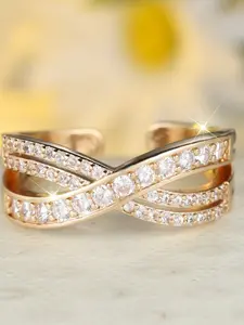 A round white diamond cross-open ring, characterized by its understated, niche, minimalist, stylish, and uniquely sparkly open design.