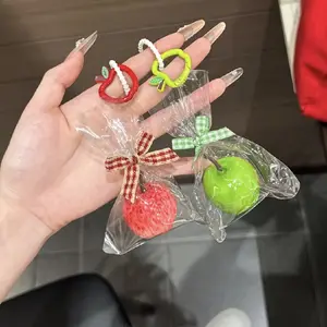 A fun and creative apple-shaped keychain bag charm for couples, popular viral gift for students and girls, suitable for Valentine's Day or back-to-school season.