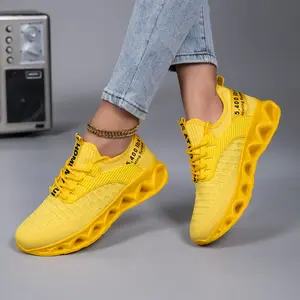 Bright yellow women's running shoes with breathable fabric and air cushioning for enhanced comfort and stability - versatile casual sneakers for fitness enthusiasts, women's sneakers