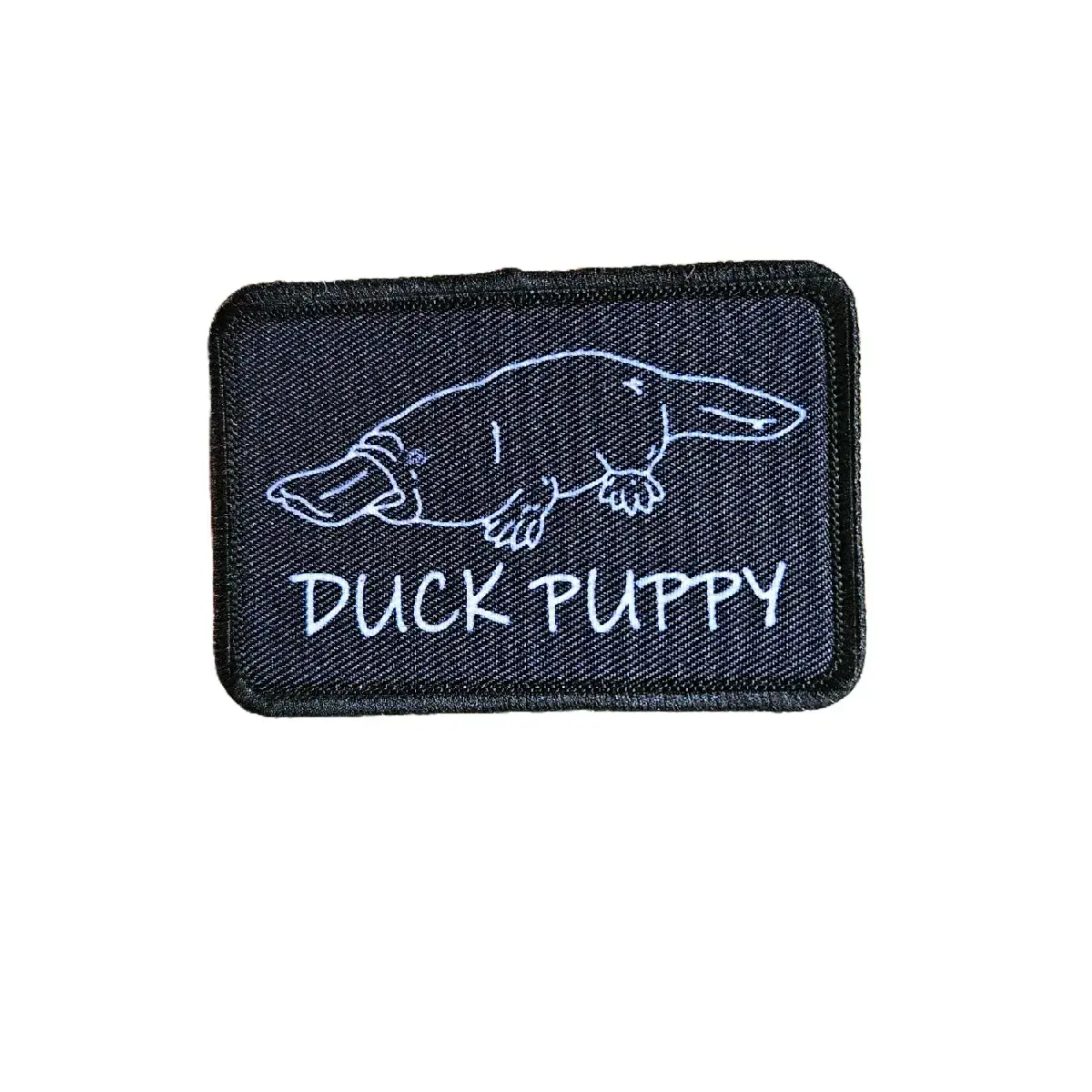 Duck puppy duck billed platypus black meme funny  2"x3" morale patch with hook and loop backing