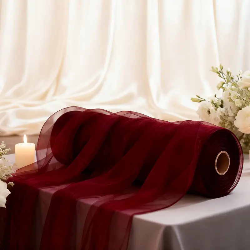 One roll of elegant burgundy sheer tulle Light Breathable Fabric in "lcb" drape, perfect for wedding arches, birthday parties, Christmas, Halloween, bridal showers, Valentine's Day, Easter, and Mother's Day.