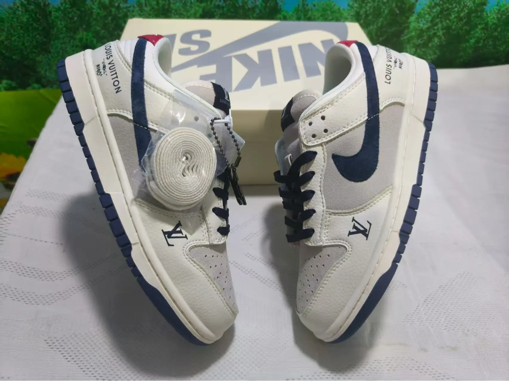 Low-top casual trainers perfect for city strolls & casual weekend coffee meetups, ultra-light perforated mixed leather off-white grey navy silhouette, open toe airflow channels, tough textured rubber outsole boosts traction on flat pavement surfaces