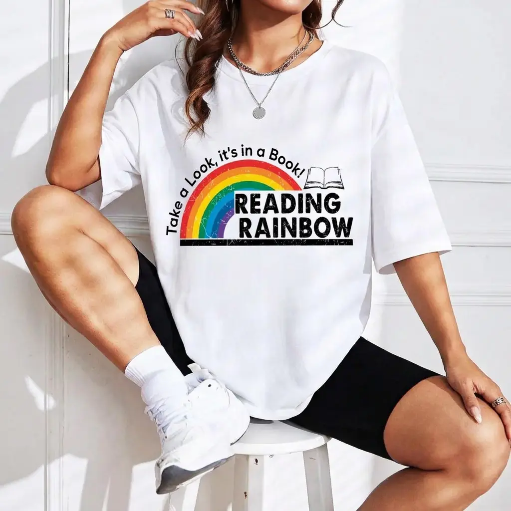 Women's Reading Rainbow "Take A Look In A Book" Print Graphic Tee, Retro 90s Aesthetic Streetwear Apparel, Oversized Round Neck Soft Cotton Casual Crewneck Short Sleeve Top For Book Lovers