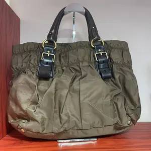 Pre-owned PRADA Olive Green Nylon Tote Bag with Black Leather Straps & Gold Buckles Stylish Durable Handbag for Everyday Use