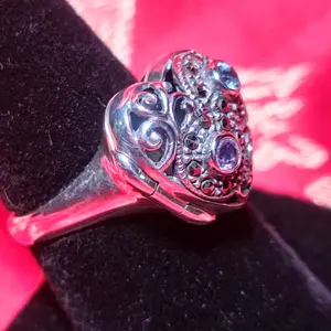 Sterling Silver locket ring with blue topaz and amethyst stones surrounded with marcuite stamped 925 Thai. Ring is size 8