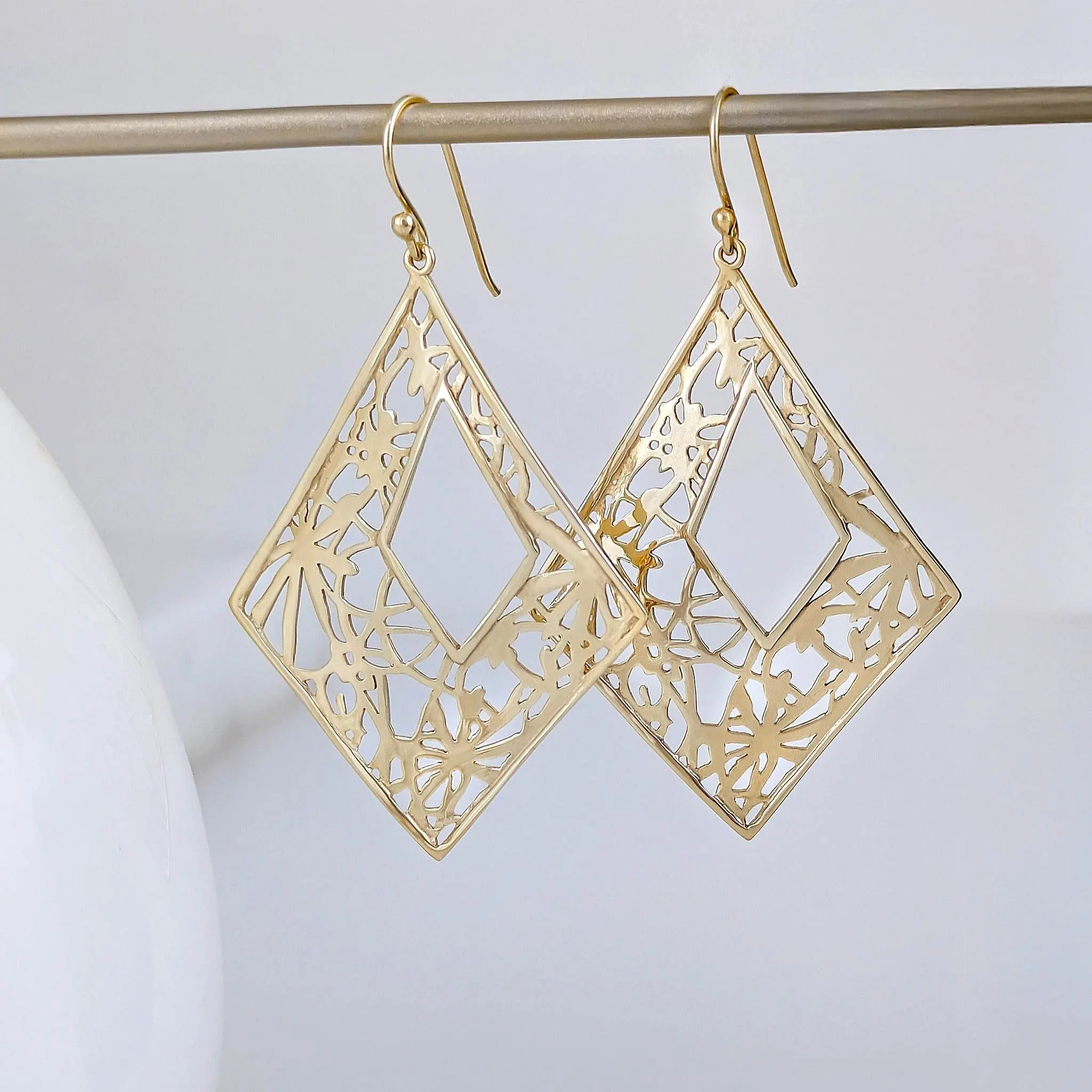 Diamond-Shape Dangle Earrings with Floral Cutout Motif