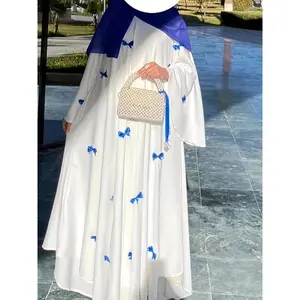 Elegant white abaya with bell sleeves and butterfly bow detail — maxi kaftan dress for women, polyester, spring/autumn wear, full-length dress style