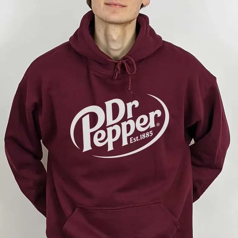 Dr Pepper Est. 1885 Hoodie – A timeless unisex cotton Hoodie for men and women. Soft, cozy, and perfect for any soda lover!