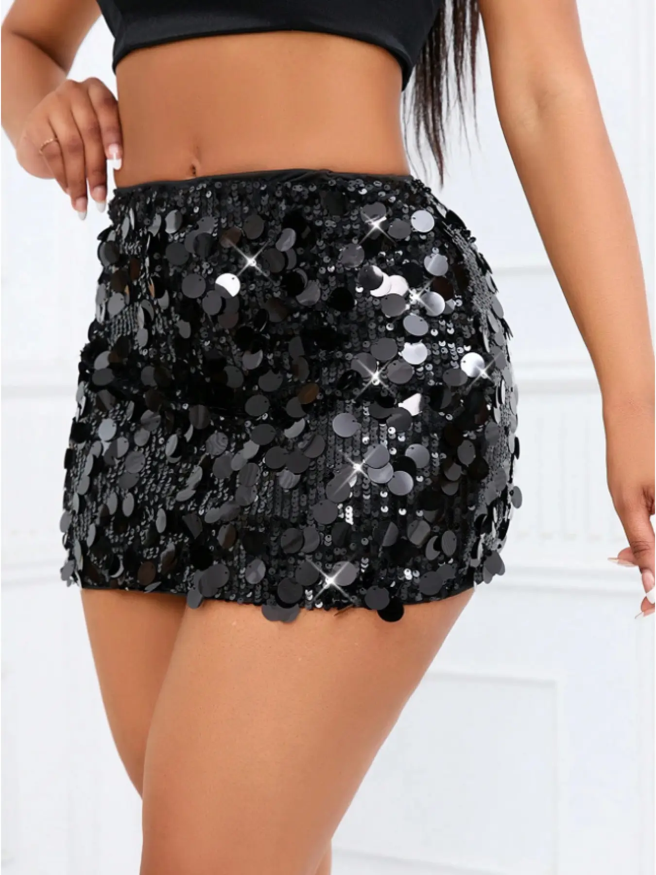 Trendy sequined mini bodycon dress for holiday outfits and parties.