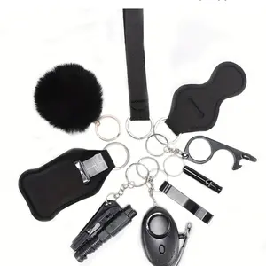 Safe Defense Keychains - Pink or Black Keychain with Keyring, Key Clip, Fluffy Ball, Survival Whistle, Personal Alarm & Liquid Soap Holder