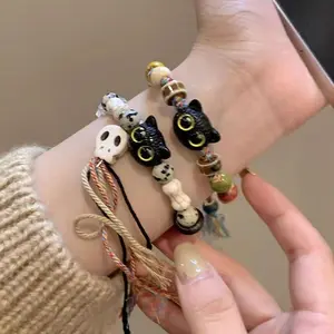 Skull cat ceramic woven bracelet women's niche design sense sweet Chinese style tassel color bracelet bracelet jewelry