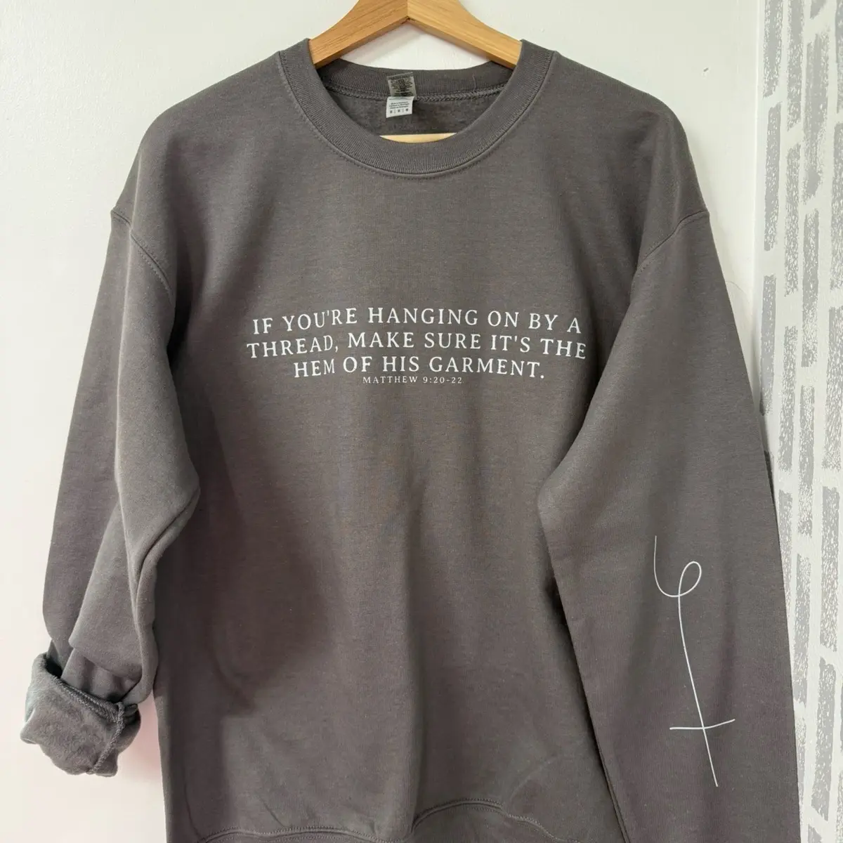 made to order If you’re hanging by a thread make sure it’s the hem of his garment crewneck. Arm sleeve design.