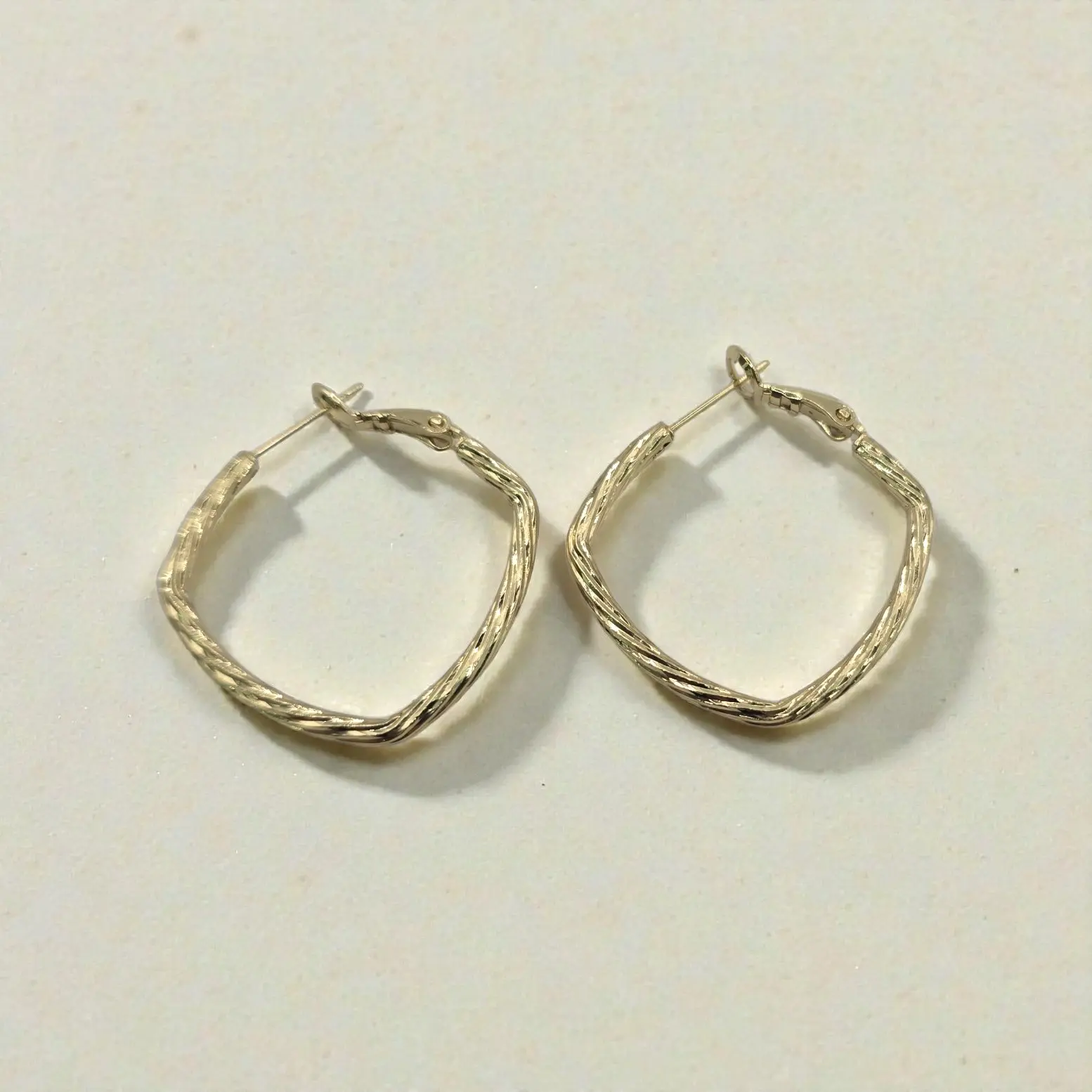 Twisted diamond shaped hoops Twisted diamond shaped hoops
