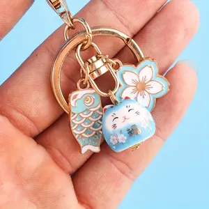 1/20pcs Cherry Blossom Lucky Cat Keychain - Round Ceramic Charm with Floating Design, Secure Clasp for Sports Fans