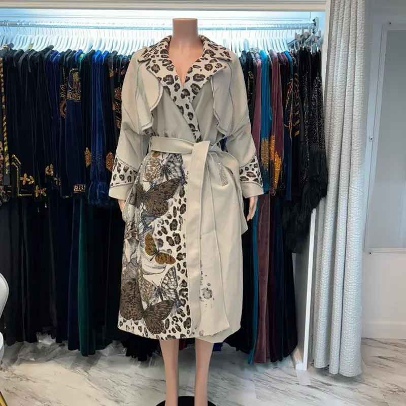 beige wool coat with floral and butterfly design with rhinestones
