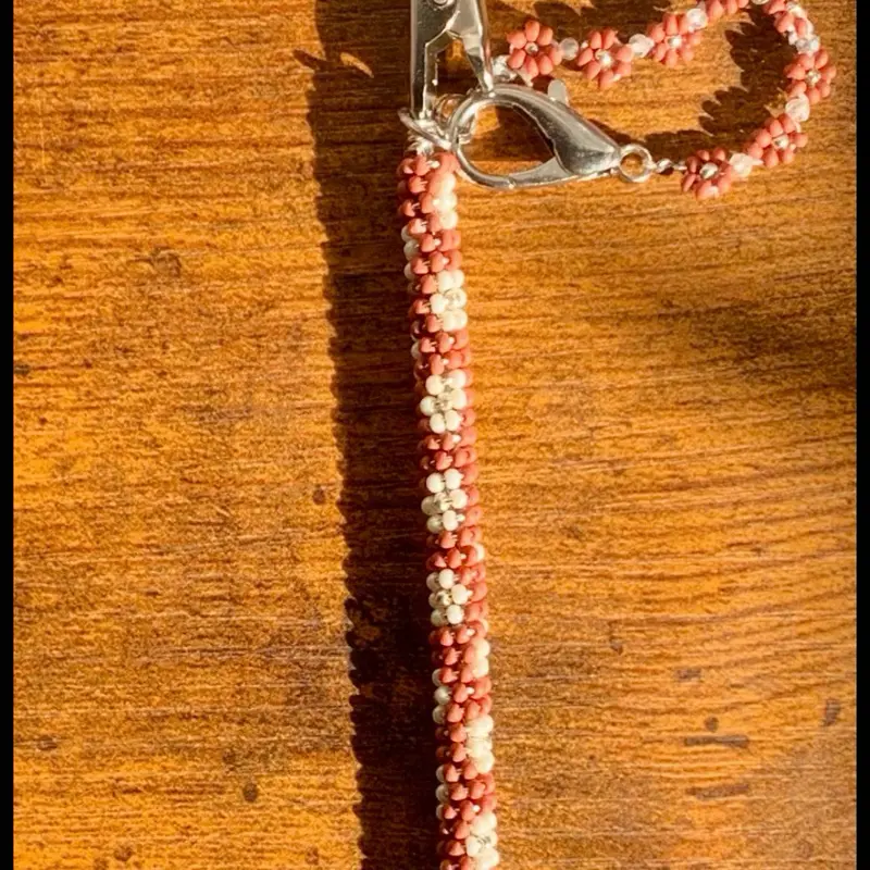 Dark pink floral beaded roach clip with daisy chain clip