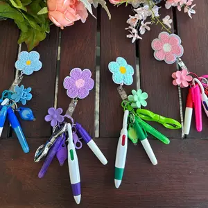 Badge Reel (Flowers or Bow) with Accessories Mini Highlighter, Marker, Retractable multicolor Pen, Nursing Keychain Clip, and LED Flashlight Keychains badgereels great gift