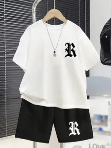 Boys’ casual summer short-sleeved set with a cross pattern, a stylish outdoor sports outfit for spring and summer; a two-piece matching outfit set comprising a T-shirt and shorts for boys, the perfect choice for outdoor wear