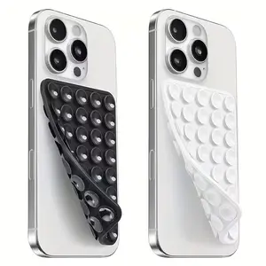 Multifunctional silicone suction cup with 24 surfaces; features a strong, adhesive-backed design for secure attachment to walls; ideal for use as a phone stand, showerhead holder, selfie stick, or portable home accessory.