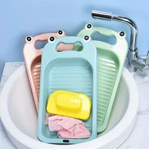A cute frog shaped washboard with anti slip handle and hanging storage function, a multifunctional laundry basin suitable for underwear, socks, and towels. Durable plastic compact washboard, suitable for bathrooms, dormitories, or household use.