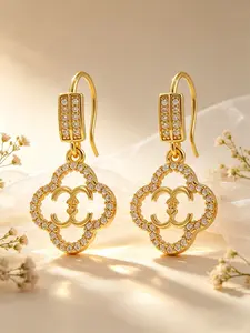 Double C earrings, featuring a four-leaf clover design and double C motifs, made of copper plated with 18k gold, exuding elegance and luxury