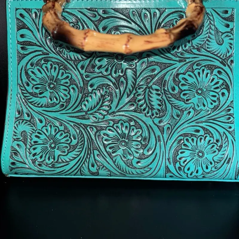 Turquoise hand tooled top handle handbag