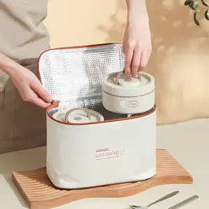 Beige sturdy heated lunch box set made of 316 stainless steel with multi-layer insulation; microwave-heated portable lunch box with independent compartments of 420 ml and 620 ml; leakproof bento box equipped with an insulated bag and high-grade plastic ta