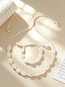 2 pieces per set, bracelet and necklace set, natural shells, hand-woven, off-white, for beach outfits, summer, beach, cool feeling, accessory, in the style of Instagram, simple, must-have for beach vacations, Bohemian shell set, Boho Jewelry Set