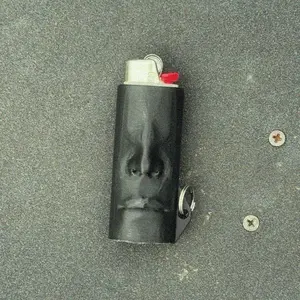 Mini Head Lighter Case - Black Cylinder Shape with Unique Design and Key Ring Feature