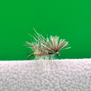 Elk Hair Caddis dry fly with an orange body.
