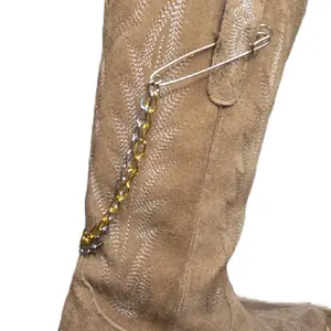 The Original Boot Jewelry Two-Tone Double Chain Boot Charm Features dual-layer chains in mixed metal tones with secure with heavy duty safety pins that easily attach to boot pull tabs. Removable, interchangeable