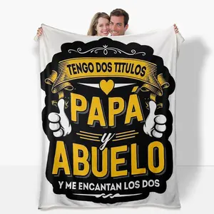 Spanish "Papa y Abuelo" Flannel Blanket: "I have two titles: Dad & Grandpa, and I love them both!" with thumbs-up emblems. Super soft & cozy for all seasons, decor, naps. Perfect gift from son/daughter