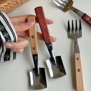 A set of forks and spoons, featuring an Instagram-style design with vintage wooden handles, stainless steel dessert spoons, cute shovel-shaped spoons, and small forks for watermelon.