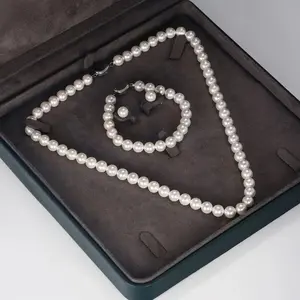 Pearl imitation necklace, bracelet and earrings set - a three-piece jewelry collection. The selected imitation pearls necklace is an excellent choice as a party gift.