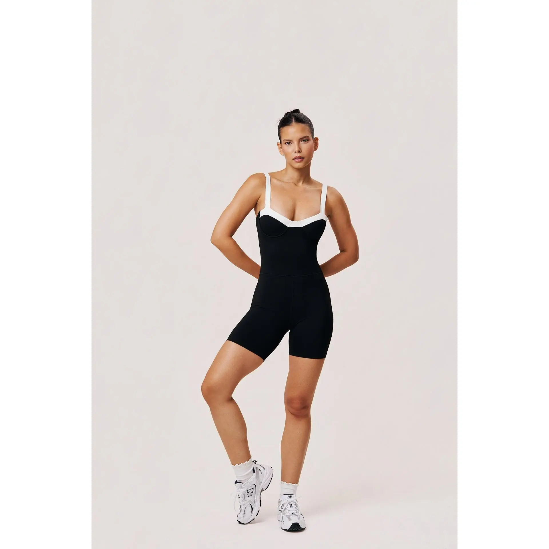 Gaia Romper | Women’s Black and White Workout Romper – Underwire Pilates Romper with Twist Back
