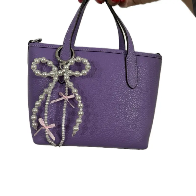 Pearl Bow Keychain -  Accessory with Elegant Pearl Design and Pink Ribbon Detailing