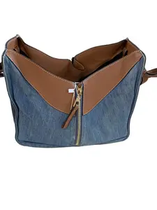 Pre-owned Loewe Hammock BagLarge Denim Large Denim Hammock Bag | Handbag, Shoulder & Crossbody Bag Multi tone patchwork denim paired with caramel leather, an extremely limited edition style.