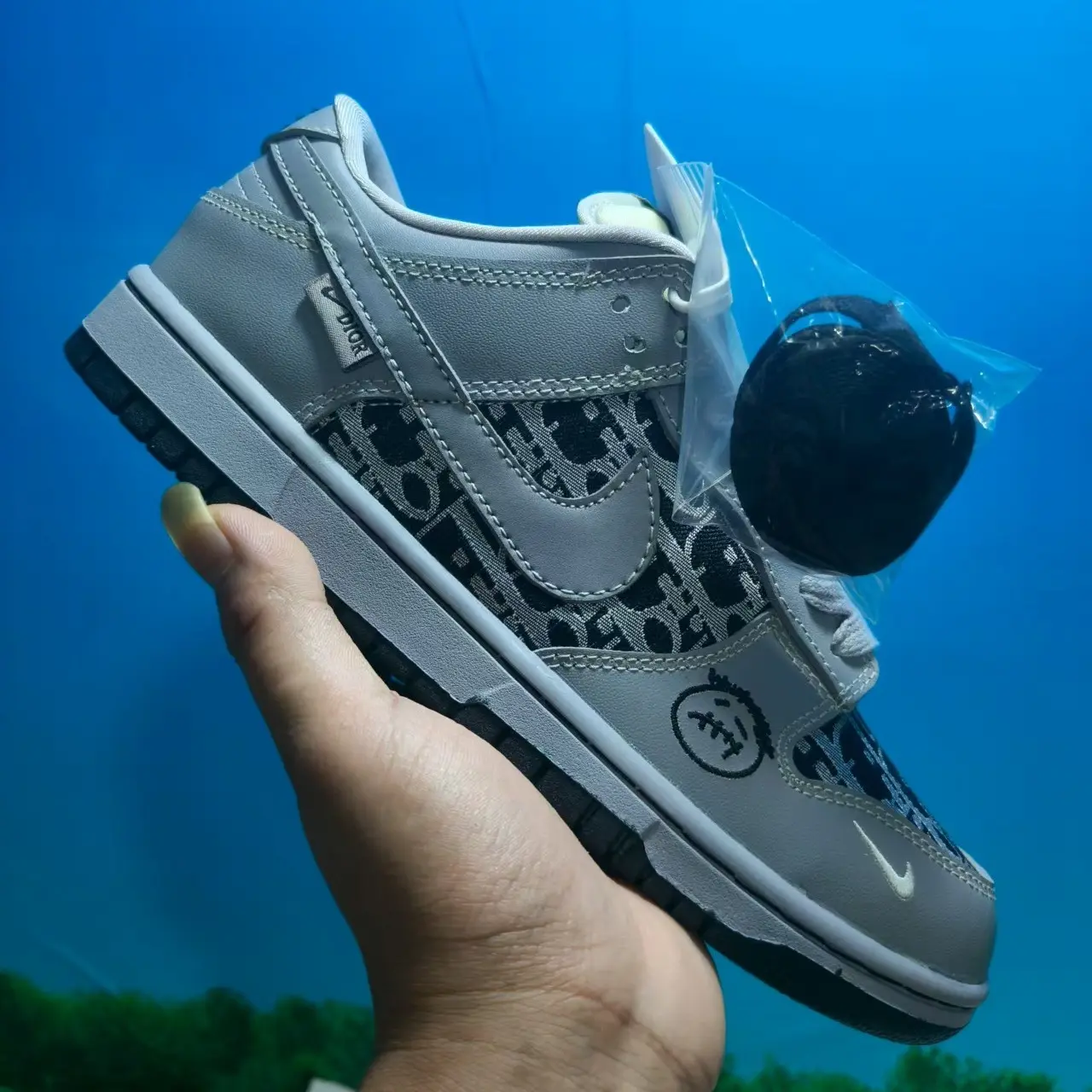 Retro low-top smooth leather casual sneakers with cushioned foam insoles to offer all-day soft walking comfort, premium light gray full-grain leather decorated with black monogram printed panels and cute cartoon graphic details