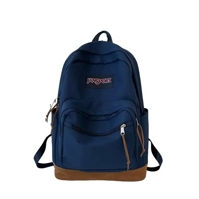JanSport Navy Blue Suede Series Backpack – High-Capacity School Bag for Students (Unisex), Suitable for Travel and Outdoor Use