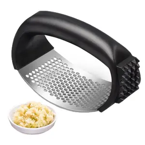 Stainless steel garlic press rocker with peeling roller, manual crusher and masher tool for easy garlic preparation, kitchen appliance, home cooking, non-slip handle, easy to clean, compact and portable design, durable, black, sturdy.