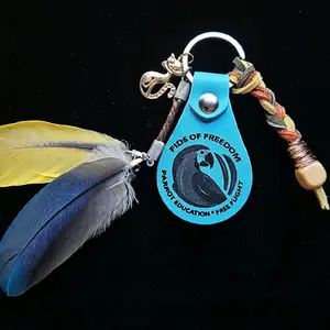 PIDS OF FREEDOM Baby Blue Kitty Leather Feather Keychain with Parrot Education Free Flight Logo and Colorful Cord