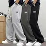 Men’s 3-pack cotton sweatpants with elastic drawstring waist, wide-leg cut, relaxed straight fit, practical side cargo pockets, American street-style trend, versatile casual long pants for everyday commuting, sports, and going out