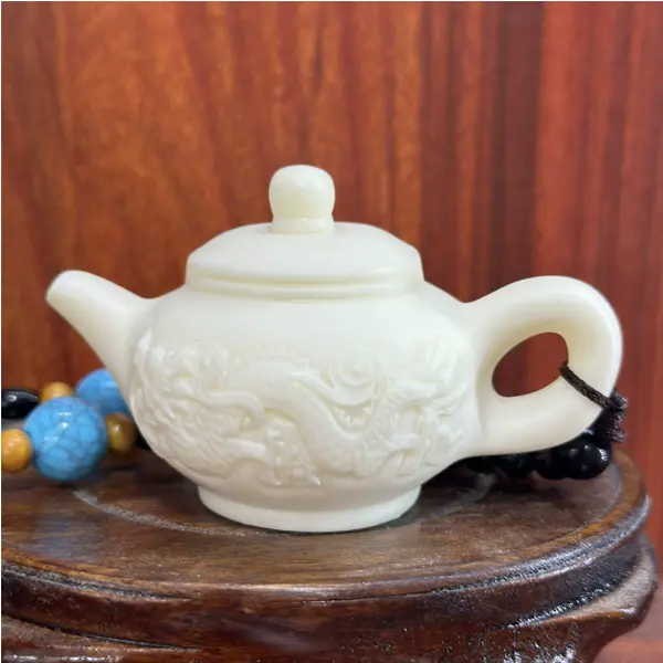 Hand-Carved Tagua Nut Double-Dragon Teapot – Artisanal Decor Ornament。 (Dimensions:7.6*5*4.7cm )