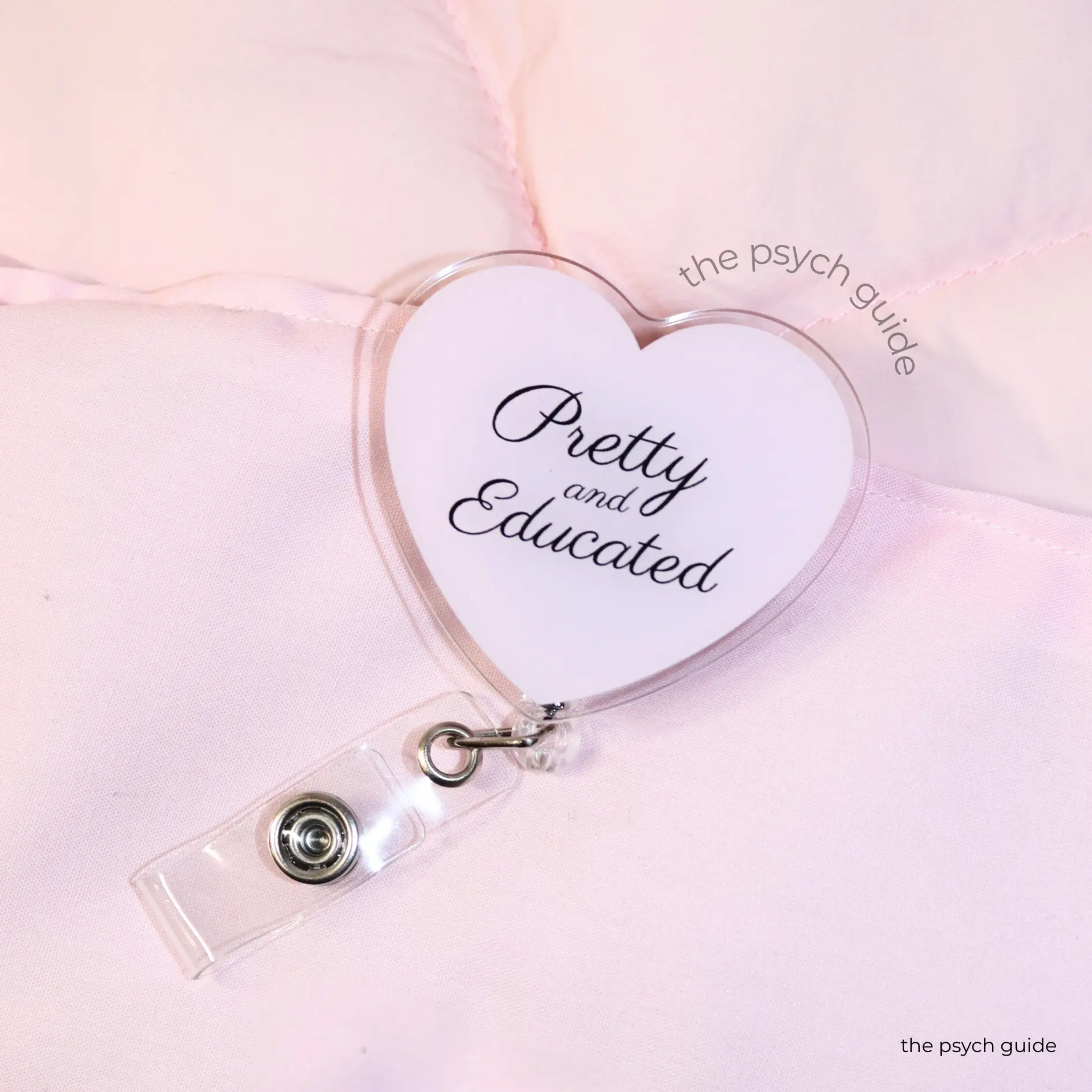 tpg | pretty and educated badge reel | baby pink heart shaped badge reel for students, nurses, healthcare workers | the psych guide pretty and educated badge reel